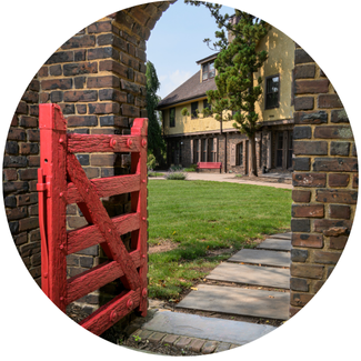 red gate in front of mansion doors
