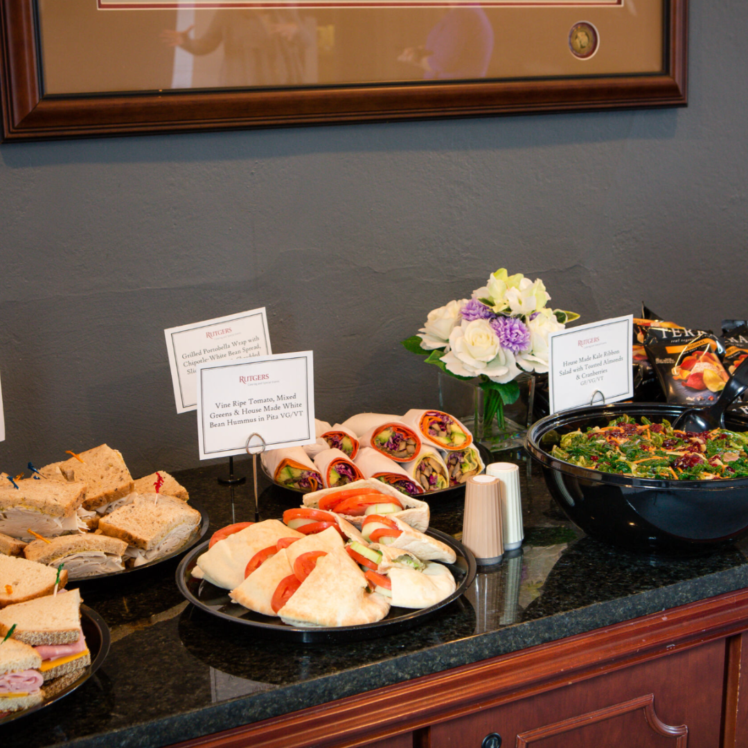 sandwiches and salads placed in buffet style for serving during a conference